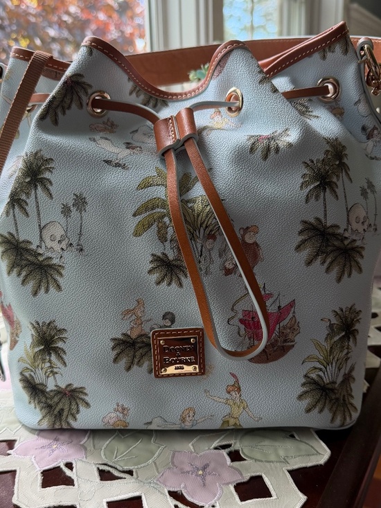 Dooney & Bourke Handbags - NWT Disney Parks Dooney & and Bourke Peter Pan Drawstring Shoulder Bag  2023
